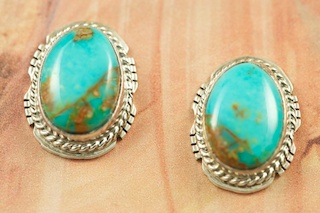 Genuine Turquoise Mountain Mine Turquoise set in Sterling Silver Post Earrings. The Turquoise Mountain Mine is located in the Mineral Park Mining District, Mohave County, Arizona. Although Turquoise Mountain is located near the Kingman Turquoise Mine it is considered a classic mine in its own right because the Turquoise is so different in appearance. It is also known as 